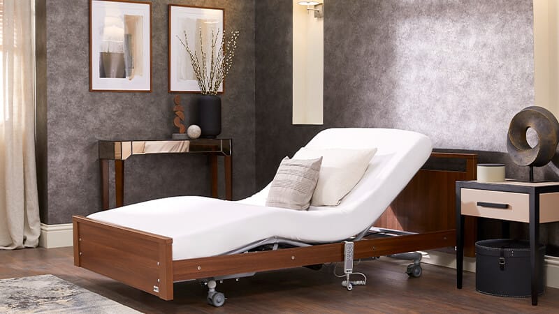 Upholstered profiling bed in a home bedroom