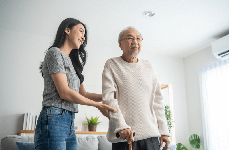 Live-in carer providing mobility support to elderly client at home in Bath